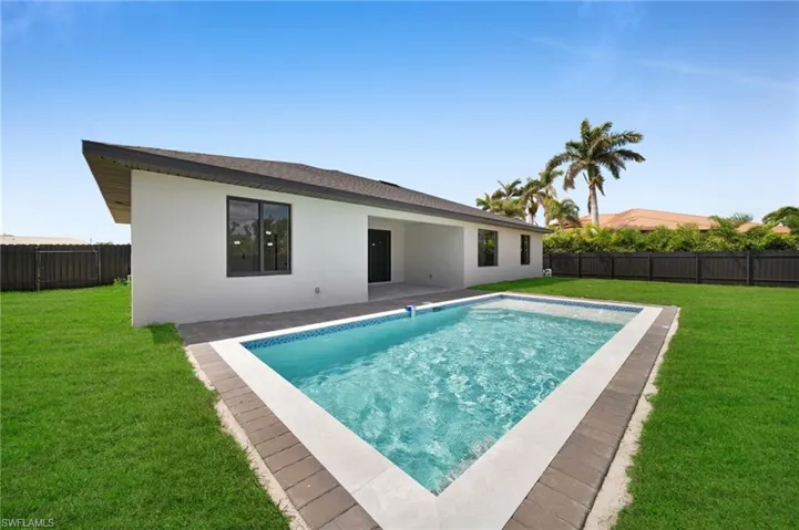View of pool featuring a fenced backyard, a fenced in pool, a patio area, and a yard