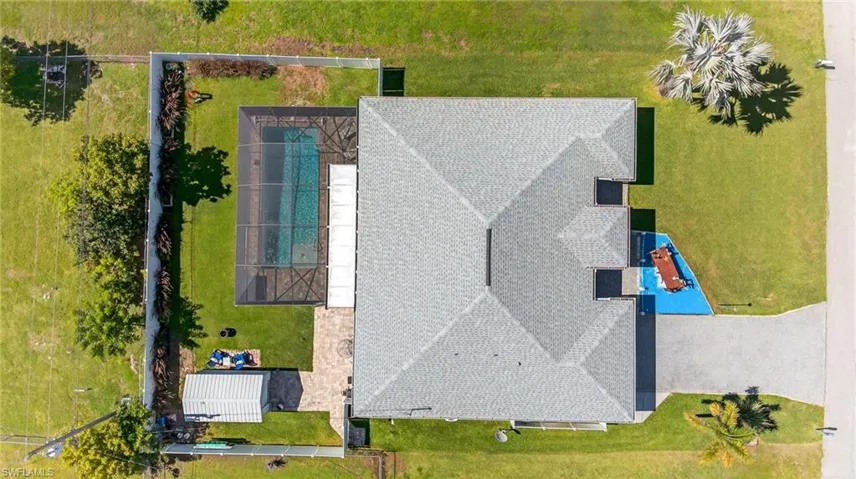 View of subject property featuring a pool area