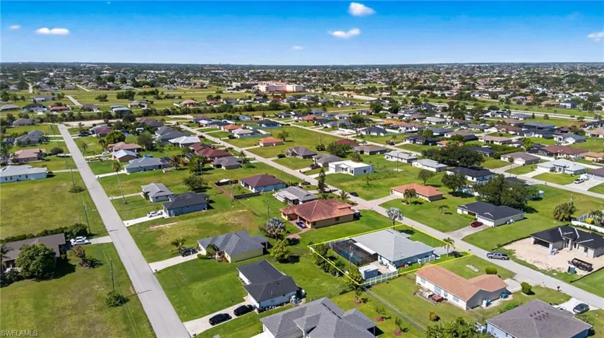 Aerial overview of property's location featuring nearby suburban area