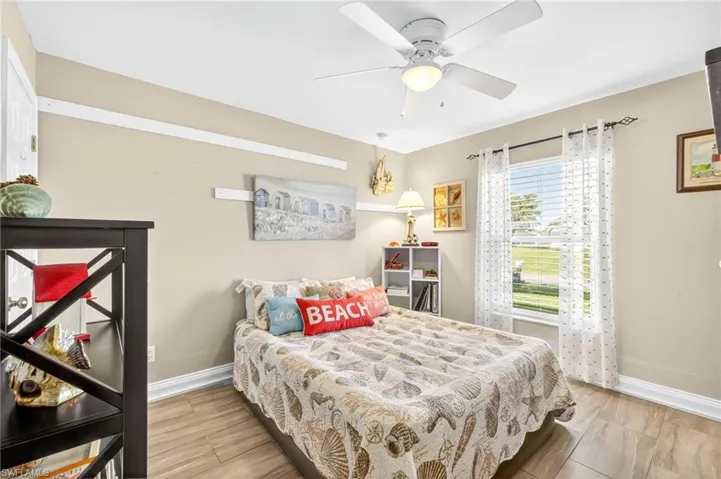 Bedroom with baseboards and ceiling fan