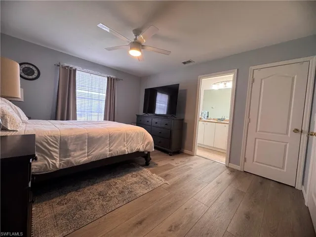 Large primary bedroom with two walk-in closets