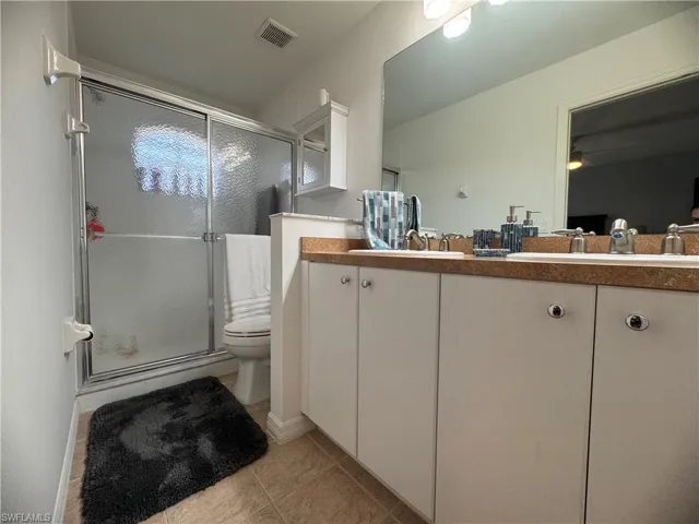 Double sinks and walk-in shower