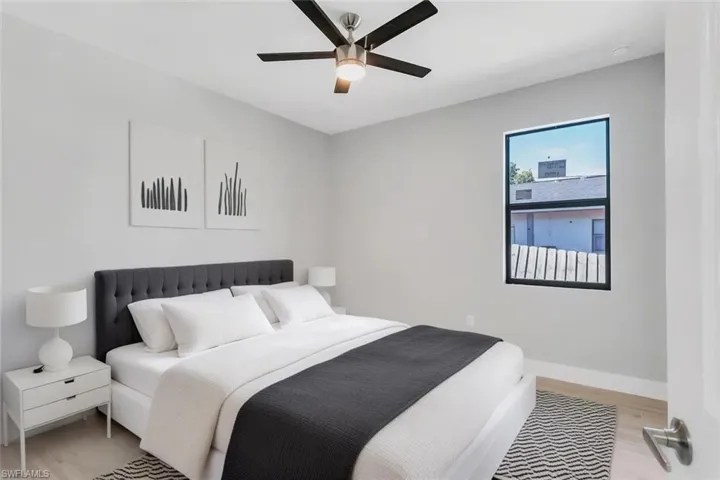Bedroom with light wood finished floors and ceiling fan