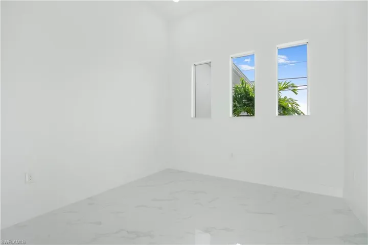 Empty room featuring tile patterned flooring