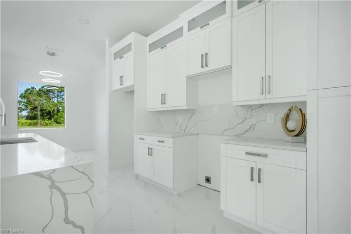 Clothes washing area with sink