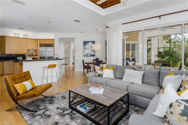 Living room featuring ceiling fan, light wood-type flooring, and recessed lighting