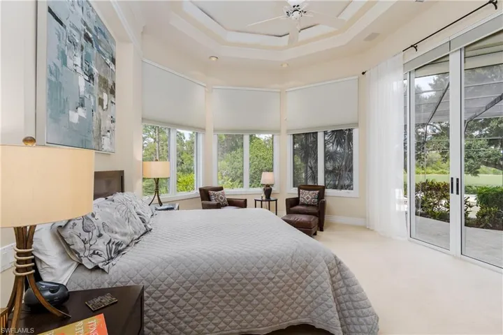 Bedroom featuring access to outside and carpet