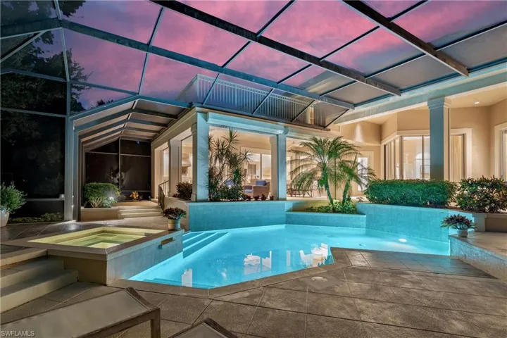 Swimming pool with an in-ground hot tub, a patio, and a lanai