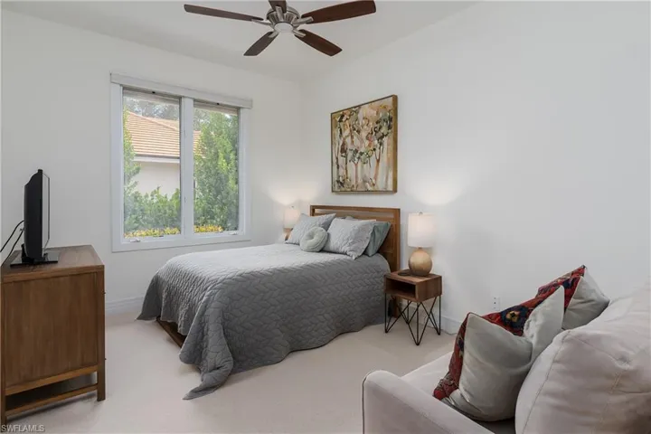 Bedroom with carpet flooring and a ceiling fan