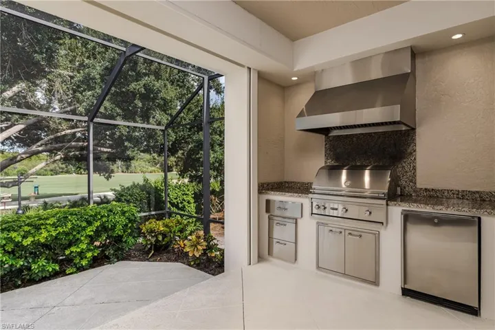 View of patio / terrace with exterior kitchen and a lanai
