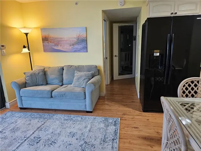 Living room with light wood-style floors