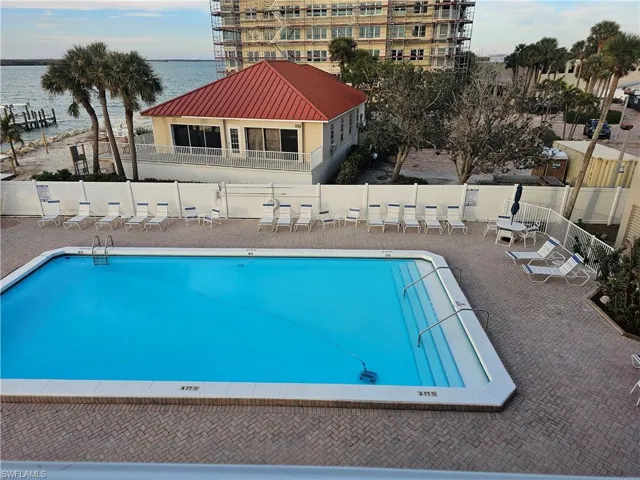 View of swimming pool and Estero Bay from balcony