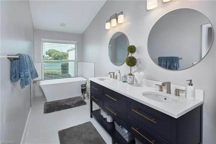 Upscale en suite bath, with dual sinks and a walk in shower.