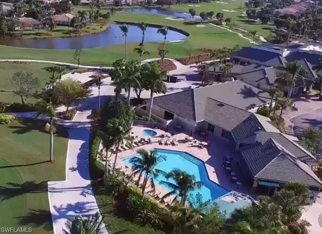 Bird's eye view of a nearby body of water and a golf club