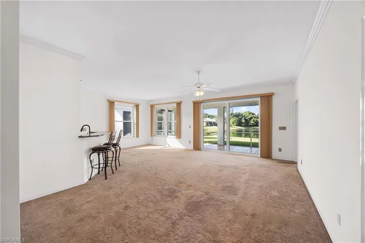 featuring crown molding, carpet flooring, and  lake views