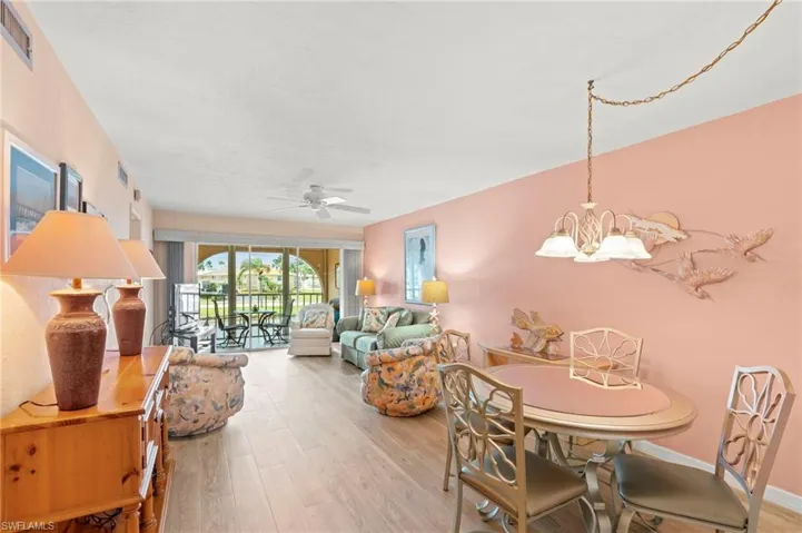 Dining space featuring light wood finished floors and a ceiling fan