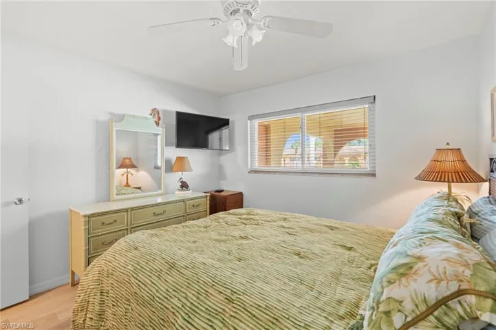 Guest Bedroom featuring light wood-style flooring and ceiling fan