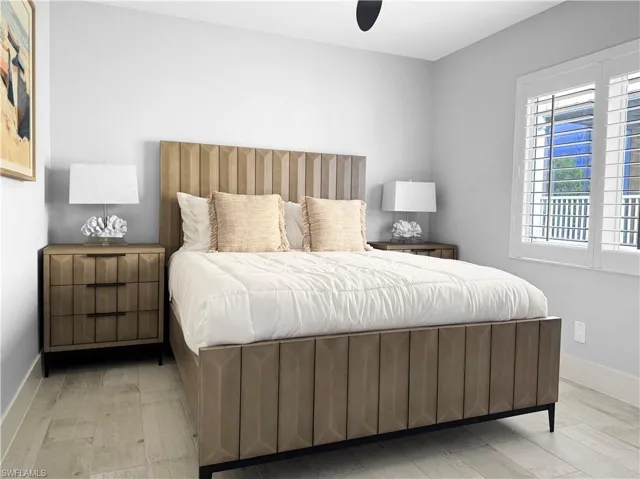 Bedroom with a ceiling fan and light wood finished floors