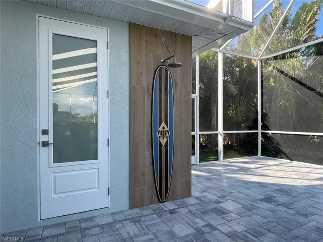 Exterior view of a sunroom and stucco siding