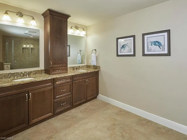 Primary bathroom features dual sinks.