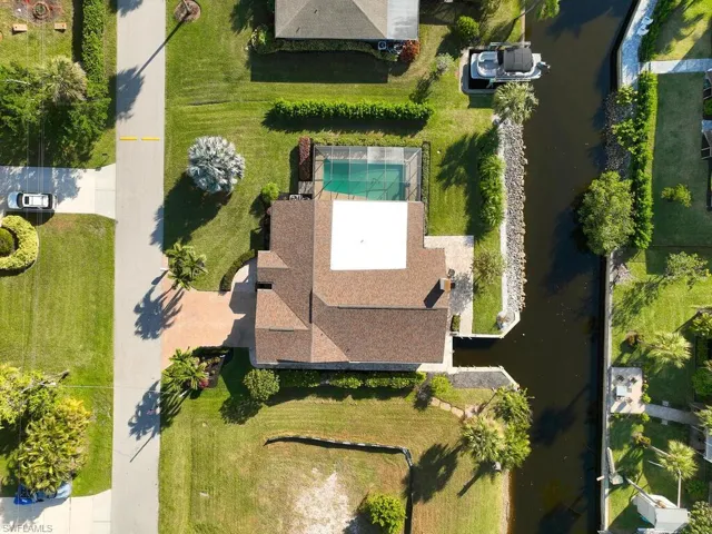 Home features a large pool AND a boat well.