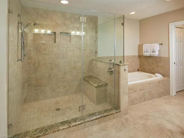 Primary bathroom offers a large walk-in shower AND soaking tub.