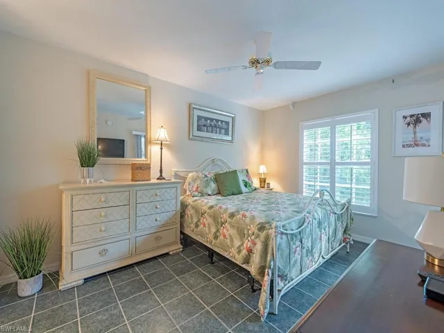 Bedroom with baseboards and ceiling fan