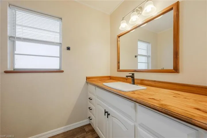 Bathroom with vanity and dark wood finished floors