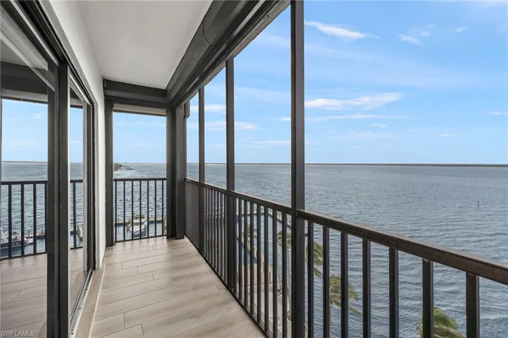Unfurnished sunroom featuring a water view