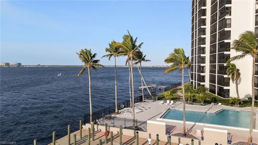 View of swimming pool with a water view