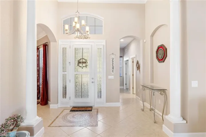 Beautiful glass front door and pillars as you enter.