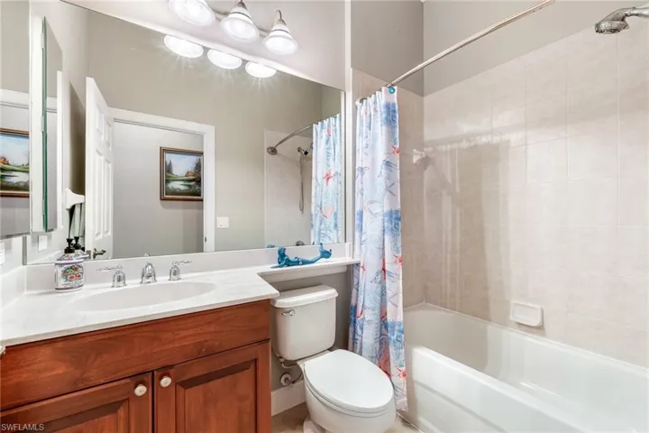 Full Bathroom adjacent to front of home den/bedroom.