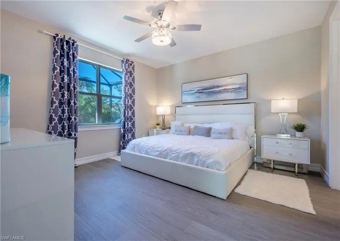 Bedroom featuring wood finished floors and a ceiling fan