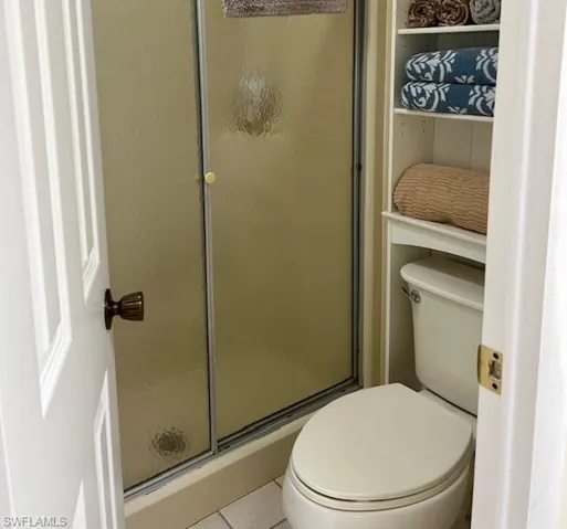 Bathroom featuring a stall shower and tile patterned floors