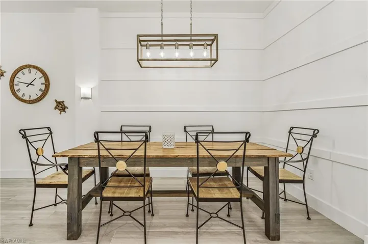 Dining area with hardwood / wood-style floors and breakfast area