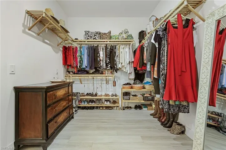 Spacious closet featuring light wood-type flooring