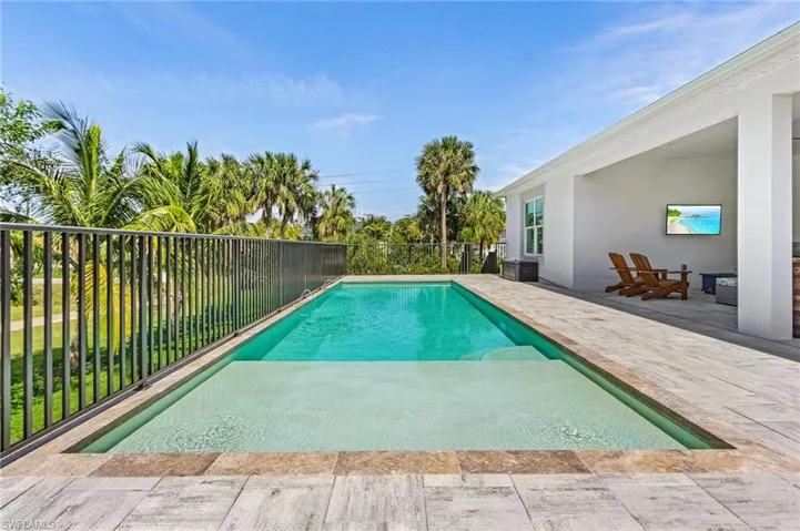 View of swimming pool with a patio area