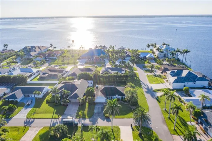 Aerial view of residential area with a large body of water