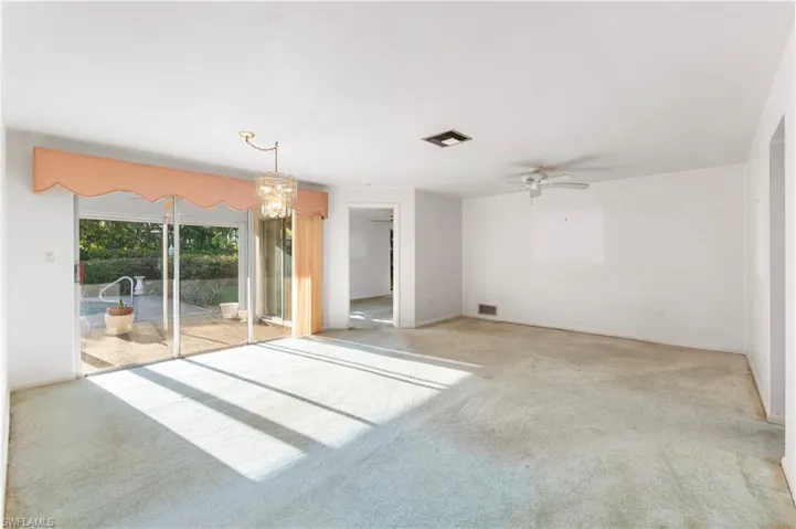 Unfurnished bedroom featuring carpet floors and a ceiling fan