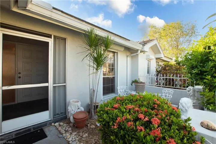 View of property exterior with stucco siding