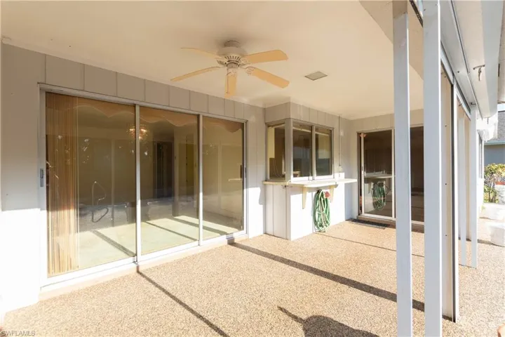 View of swimming pool featuring a patio area and ceiling fan