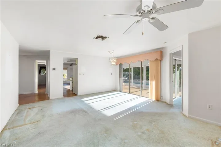 Hall with baseboards and carpet