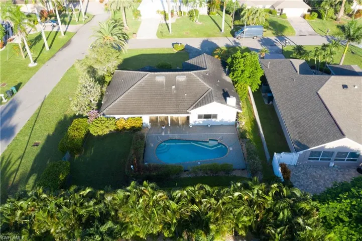 View of subject property with a pool area