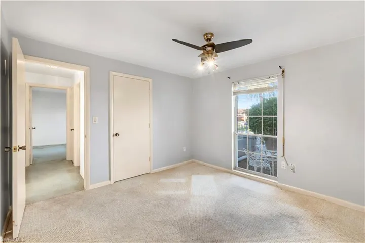 Laundry room with electric water heater and washer and dryer