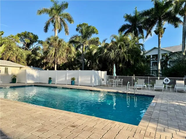 Community pool with a patio area