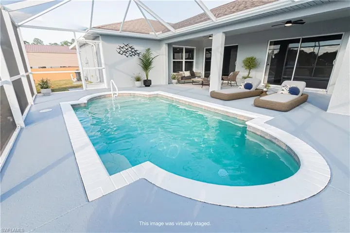 Swimming pool with a screened in lanai, New ceiling fans, Painted Pool Trim