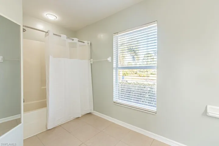 Bathroom with shower / tub combo. Natural Lighting