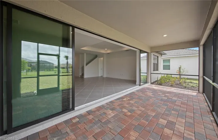 Covered lanai with screen. Pocket sliding door.