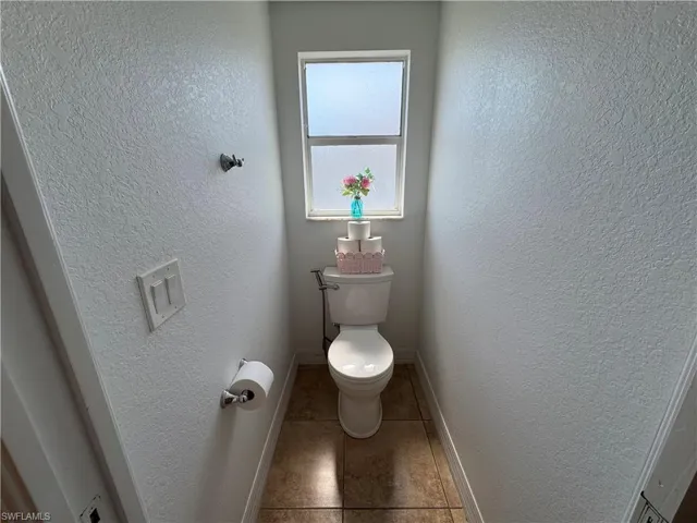 Bathroom featuring a textured wall