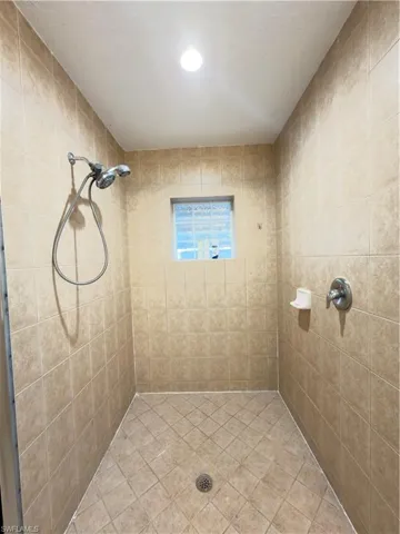 Bathroom with a tile shower